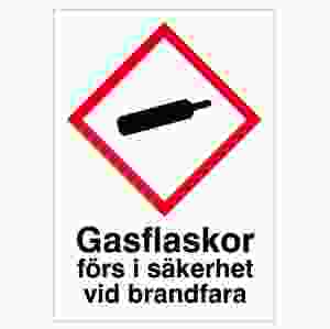 Gasflaskor förs i säkerhet.. (skylt)